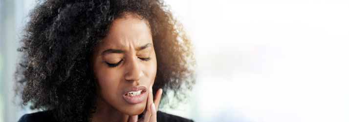 Chiropractic Louisville KY Woman with Jaw Pain